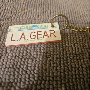 1980's L.A. Gear California license plate keychain tag